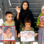 Woman Protests with Children Over Non-Arrest of Husband’s Alleged Killer, Demands Justice and Protection